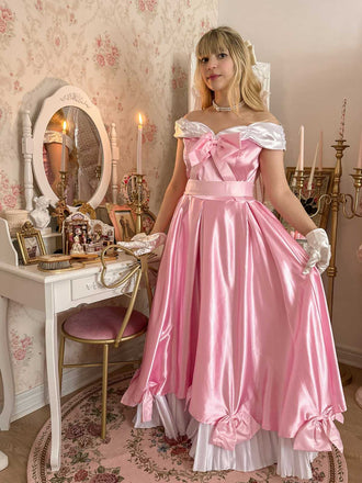 Abito da principessa con fiocco in raso spalle scoperte rosa anni '50