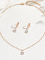 Set di orecchini pendenti e collana in oro