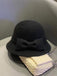 Cappello a cloche con fiocco in lana sintetica