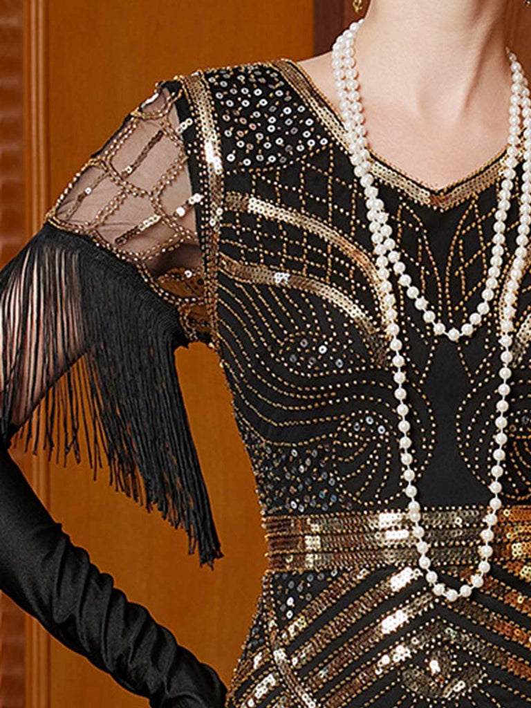 Abito lungo in paillettes e nappe con scollo a V oro anni '20