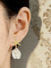 Orecchini pendenti con perle e conchiglie a stella marina in oro