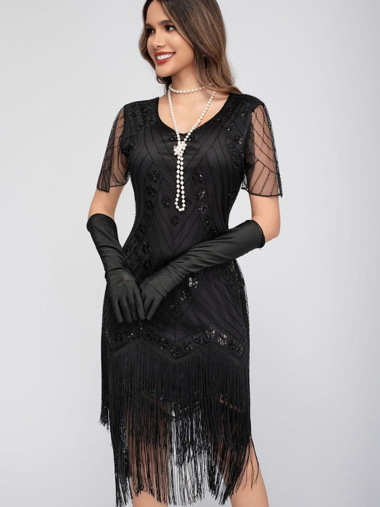 Abito maniche ad aletta perline e nappe in paillettes anni '20