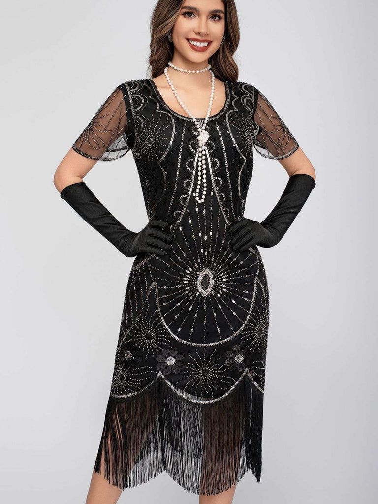 Abito flapper con frange di paillettes e scollo a barchetta anni '20