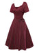 Abito a quadri con scollo a cuore e fiocco rosso anni '50
