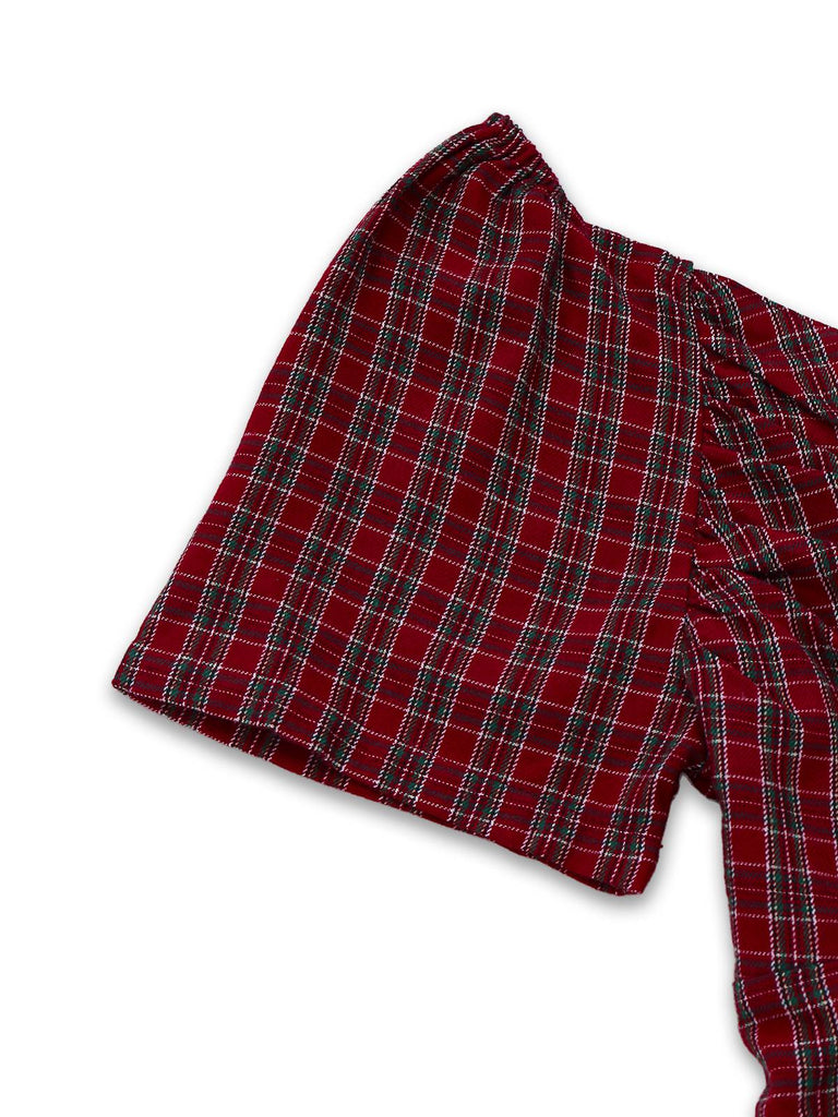 Abito a quadri con scollo a cuore e fiocco rosso anni '50