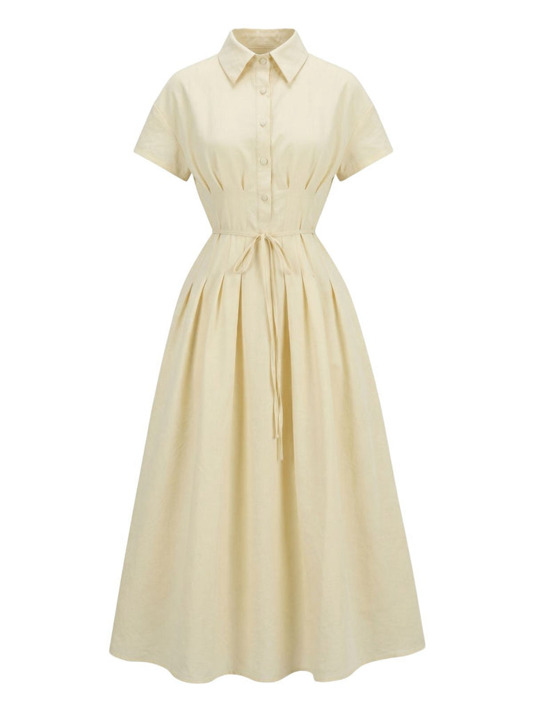 Abito con colletto a camicia e bottoni annodati in vita giallo anni '40