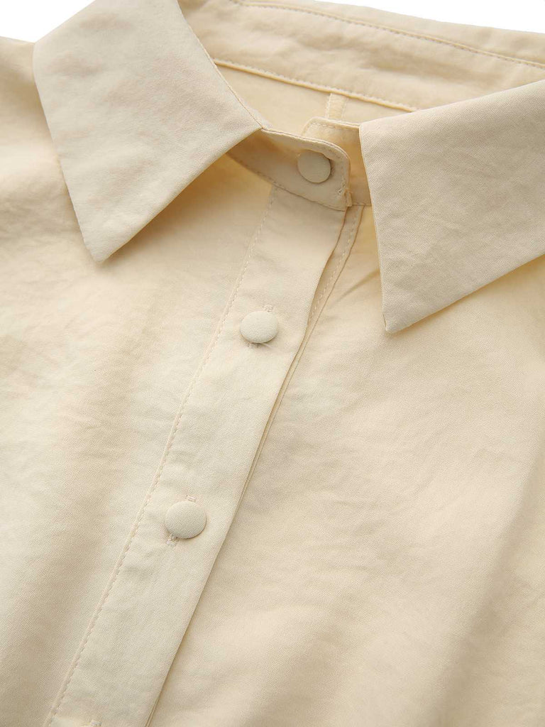 Abito con colletto a camicia e bottoni annodati in vita giallo anni '40