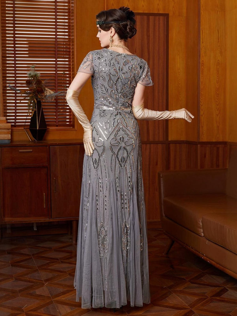 Abito con paillettes e maniche ad aletta in tulle grigio anni '20