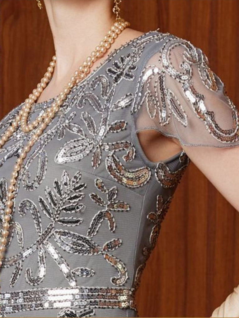 Abito con paillettes e maniche ad aletta in tulle grigio anni '20