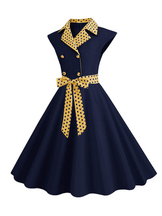 Abito a pois a contrasto con cintura e fiocco blu scuro anni '50