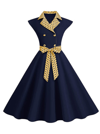Abito a pois a contrasto con cintura e fiocco blu scuro anni '50