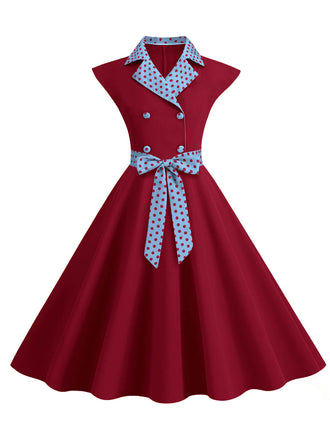 Abito a pois a contrasto con cintura e fiocco anni '50