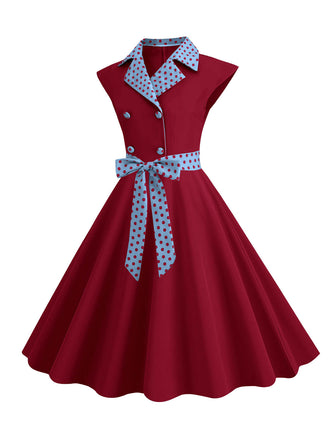 Abito a pois a contrasto con cintura e fiocco anni '50