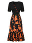Abito patchwork floreale con scollatura irregolare nero anni '30