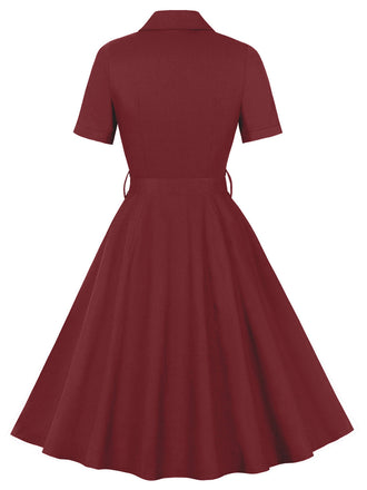 Abito con cintura e revers a tinta unita bordeaux anni '50