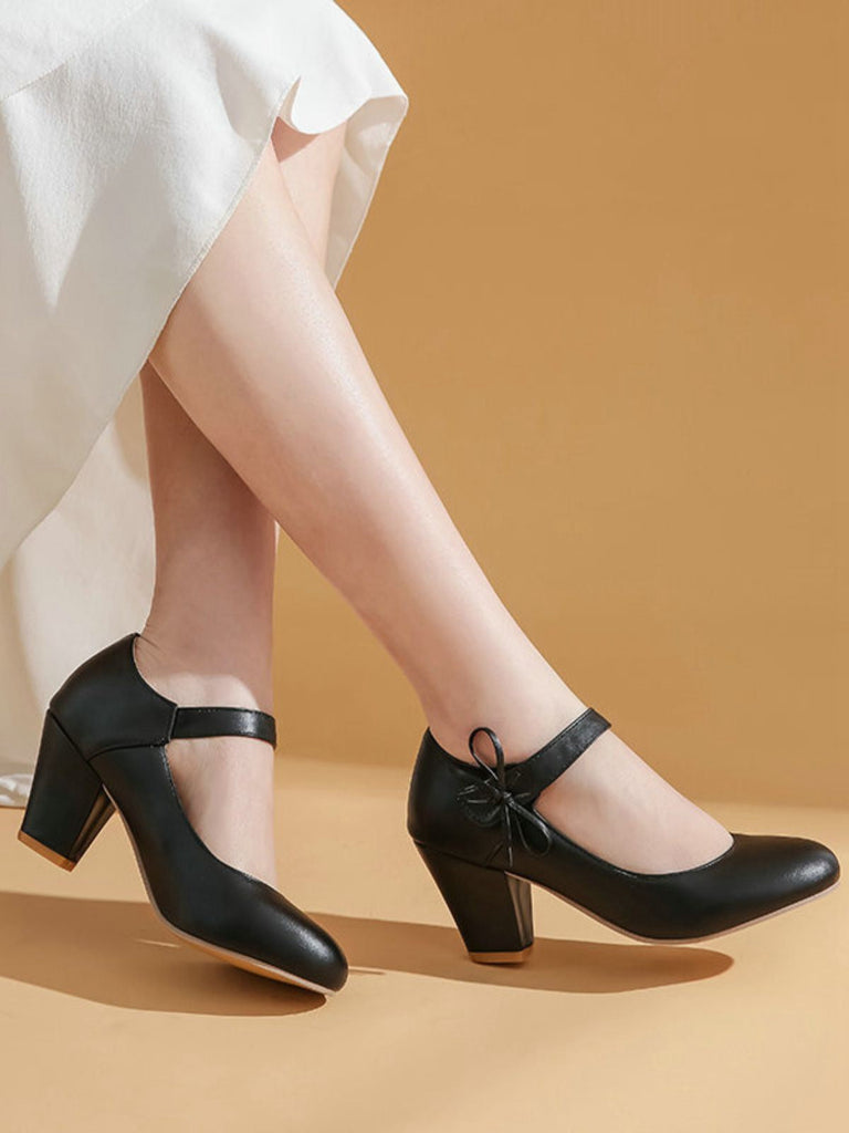 Scarpe con tacco grosso e fiocco punta tonda e tinta unita