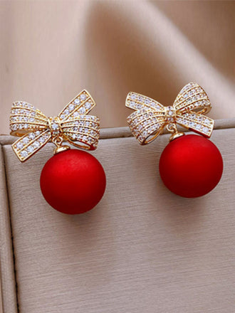 Orecchini con fiocco di Natale rosso e diamanti