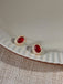Orecchini vintage con diamanti e cristallo ovale rosso