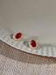Orecchini vintage con diamanti e cristallo ovale rosso
