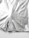 Close-up of metallic silver Romper on a light gray background