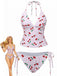 Bikini rosa con motivo a ciliegie su sfondo bianco