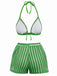 Green and white bikini set on a white background