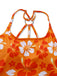 Close-up of the polished silver metal ring connecting the orange floral print straps on the back of the swimsuit.