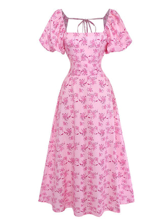 Front studio view of the pink floral midi dress highlighting the fitted waist and flared skirt.
