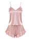 A dusty pink two-piece silky satin pajama set featuring a simple V-neck camisole top and matching shorts with a ruffled hem.