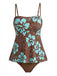 Full front view of the brown and turquoise tropical print tankini top paired with matching brown bikini bottoms.