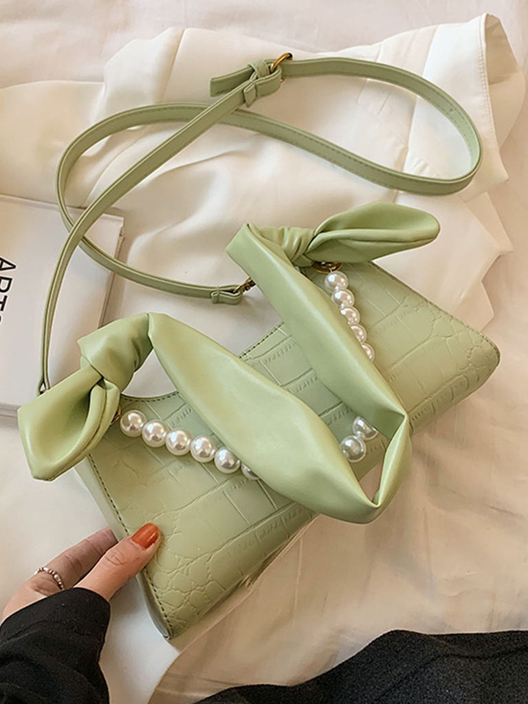 Borsa hobo in tinta unita con catena di perle retrò