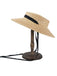 Cappello in rafia intrecciata con nastro nero